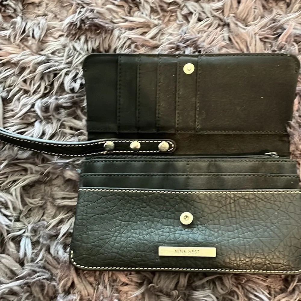 Black with silver details and lacing wristlet good condition